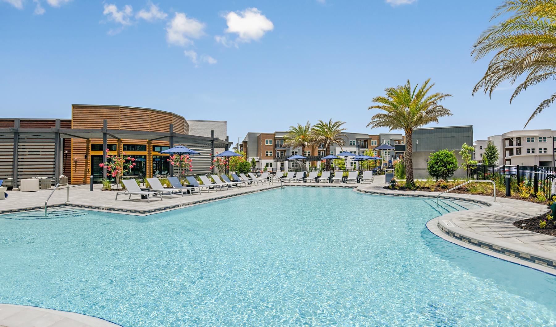 a swimming pool with a building in the background